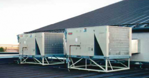 A frame-mounted HVAC unit can be supported without roof penetration by using seam clamps.