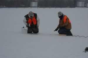 Windburn and frostbite can set in very quickly if roofing workers are not adequately dressed for cold weather. These workers are properly dressed.
