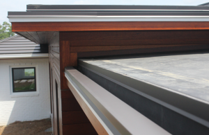 The Bermuda roof areas have a fabricated sheet-metal box gutter and the EPDM roof sections were all constructed with a built-in gutter at the eave.