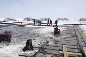 The harsh Chicago winter of 2013- 14 didn’t stop Trinity Roofing Service from completing the twoyear project on schedule. Seven miles of backer rod are being laid between seams of concrete roof channels despite snow and ice.