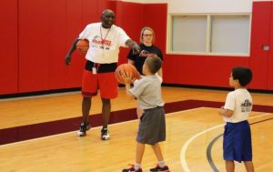 Robbie Valentine instructs campers during the annual Valentine Basketball Camps in Louisville.