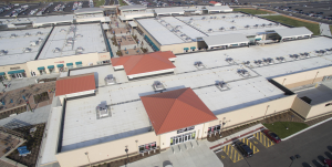The majority of the roof surface features white TPO and the gallery roofs connecting the main buildings were tan; some canopies over walkways are gray.