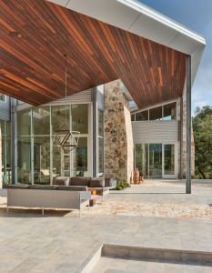 The underside of the overhanging soffit is clad with Ipe wood that ends with an edge that Carson and Brown describe as “the wing” or “the blade.”