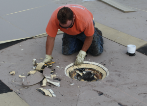 Tapered polyiso was installed to ensure proper slope to the drains, which were surrounded by an 8-foot tapered sump. 